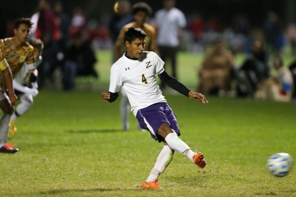 Durango‘s Marcos Delangel-Parra (4) kicks the ball for a goal against Bonanza in their ...