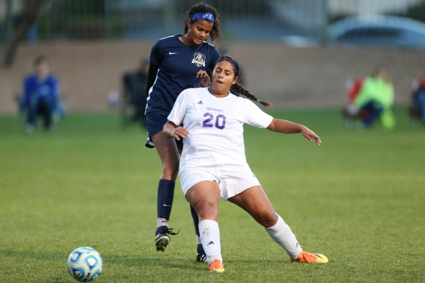 Foothill‘s Rae Burrell (12), left, and Silverado‘s Melina Amador (20) fight for ...