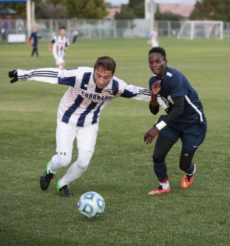 Coronado‘s Nico Glass (13) and Foothill‘s Becca Nyonyintono (5) both advance tow ...