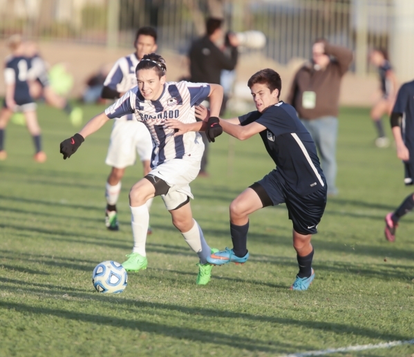 Coronado‘s Preston Judd (10) and Foothill‘s Trent Milne (4), make a move contact ...