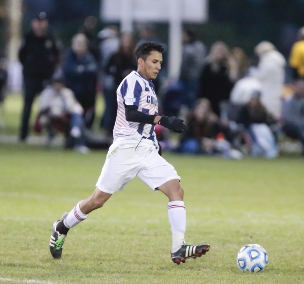 Coronado‘s Michael Ocoro (5) displays some fancy footwork while moving the ball down f ...