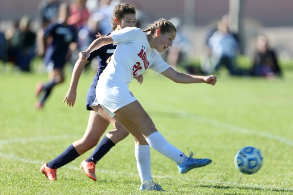 Arbor View‘s Allyssa Larkin (20) takes a shot against Centennial in their Sunset Regio ...