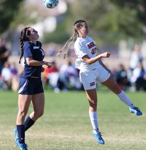 Arbor View‘s Allyssa Larkin (20) makes contact with the ball against Centennial‘ ...