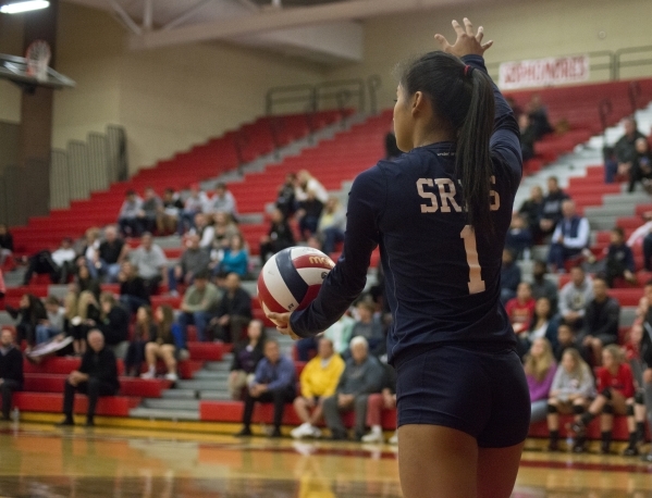 Shadow Ridge‘s Jacqui Yapching (1) prepares to serve during the Sunset Region girls vo ...