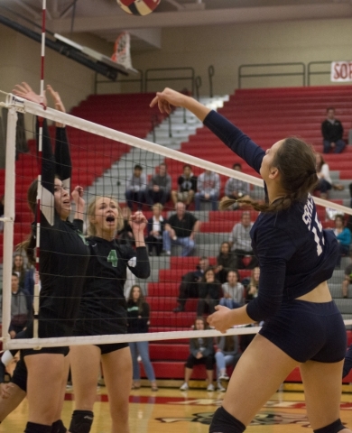 Shadow Ridge‘s Whittnee Nihipali (15) hits the ball over the net during the Sunset Reg ...