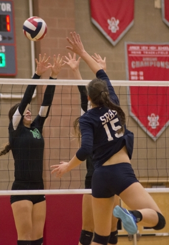 Shadow Ridge‘s Whittnee Nihipali (15) hits the ball over the net during the Sunset Reg ...