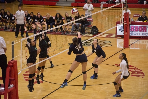 Shadow Ridge‘s Whittnee Nihipali (15) hits the ball over the net during the Sunset Reg ...