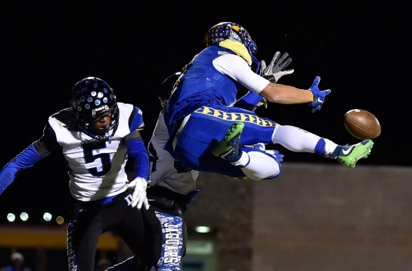 Moapa Valley‘s R.J. Hubert reached out to make a catch against Desert Pines‘ Edd ...