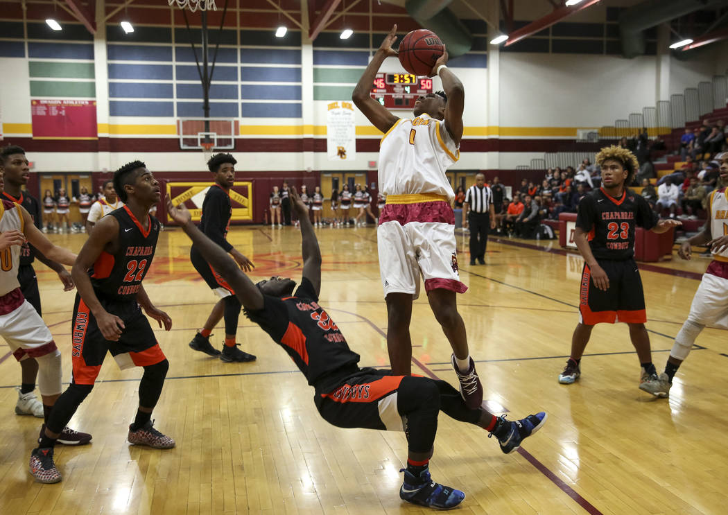 Chaparral’s Dejonte Allen (32) falls to the floors as Del Sol’s Tyrell Hampton ( ...