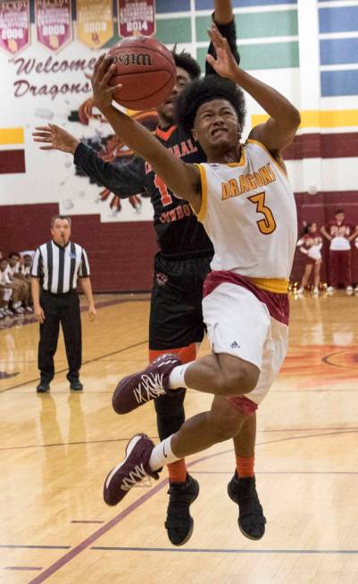 Del Sol point guard Antonio Simpson (3) goes up for a shot against Chaparral’s Cairyn ...