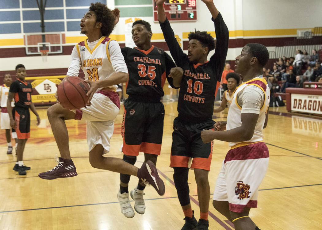 Del Sol’s Devonte Anton Villarta (10) goes up for a shot against Chaparral’s Mes ...