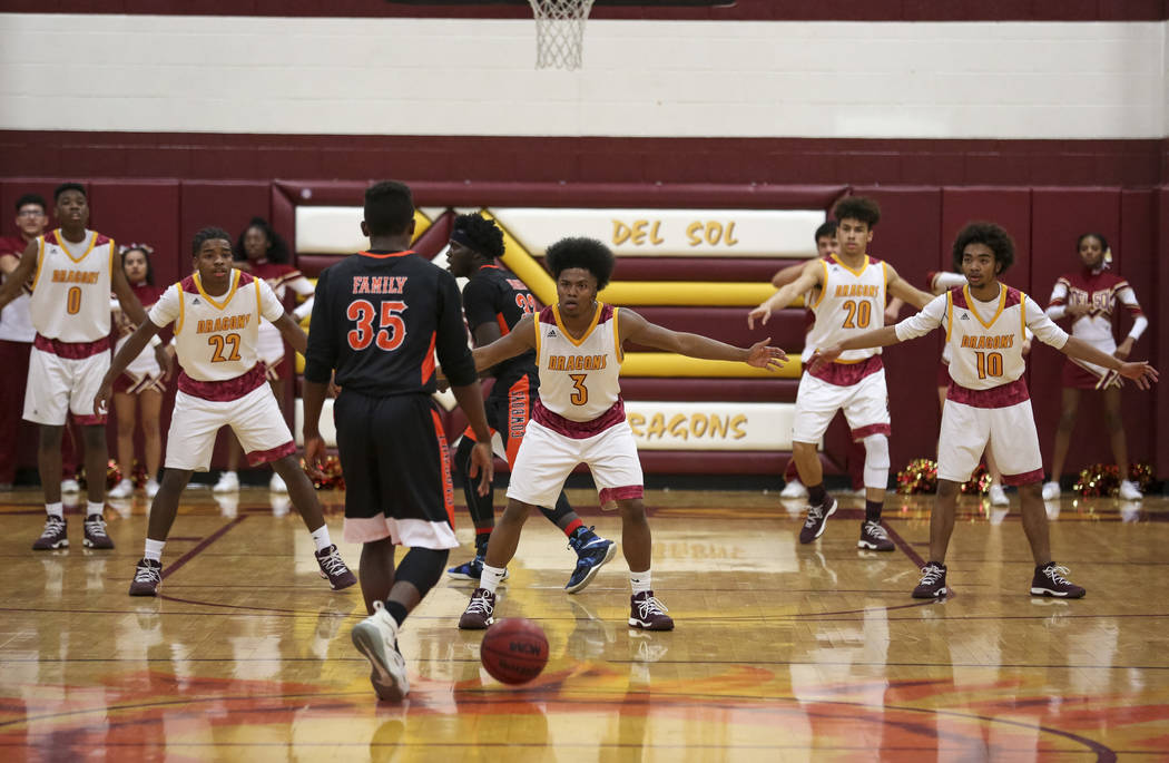 Del Sol defenders protect the court as Chaparral’s Meshach Hawkins (35) drives the bal ...