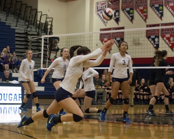 Shadow Ridge‘s Whittnee Nihipali (15) hits the ball during the Division I state semifi ...