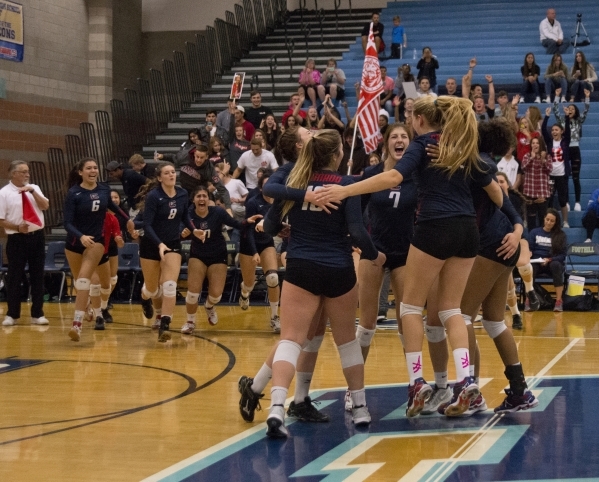 Coronado celebrates after winning the division I state volleyball final match between Corona ...