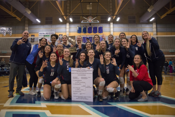 Coronado celebrates after winning the division I state volleyball final match between Corona ...