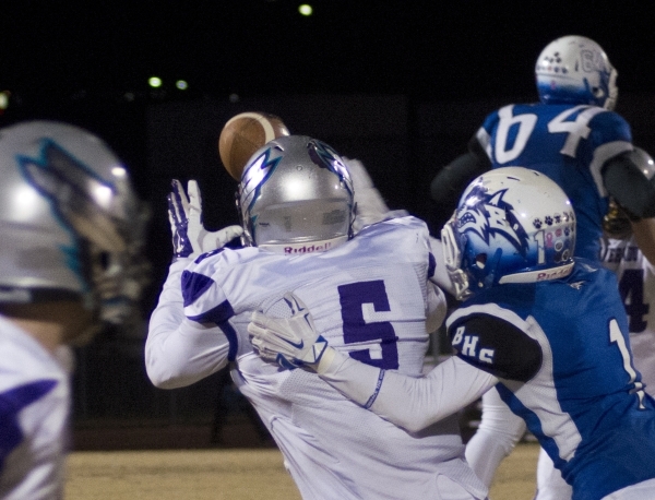 Silverado‘s T.J. Givens (5) attempts to catch a ball while Austin Owens (1) tries to b ...