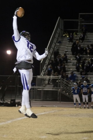 Silverado‘s Devion Clayton (12) jumps to secure a high snap before punting the ball du ...