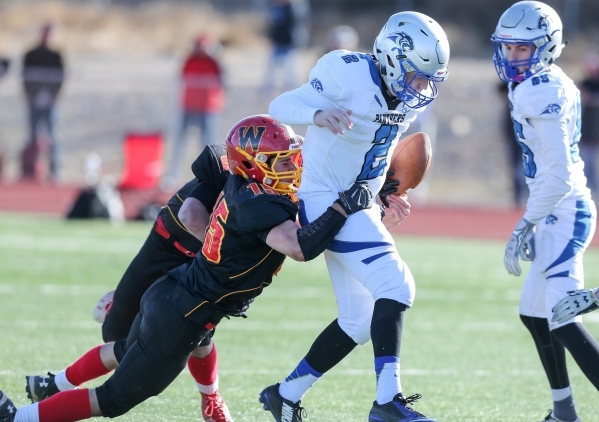 Whittell‘s Kai Mangiaracina knocks the ball loose from Pahranagat Valley quarterback T ...