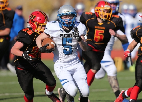 Pahranagat Valley‘s David Ingram runs in the first half of the the NIAA DIV championsh ...