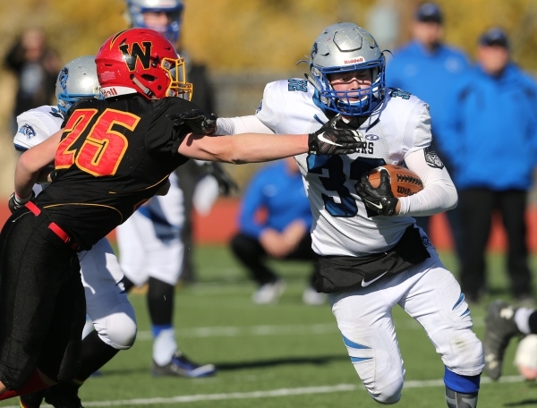 Pahranagat Valley‘s Ike Taylor runs from Whittell‘s Connor Huber during the firs ...