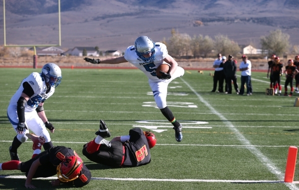 Pahranagat Valley‘s David Ingram dives into the end zone for a touchdown in the first ...