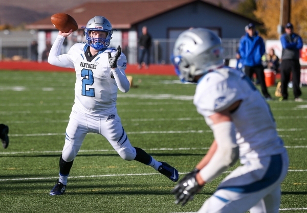 Pahranagat Valley‘s Tabor Maxwell passes to Shawn Wadsworth for a touchdown during the ...