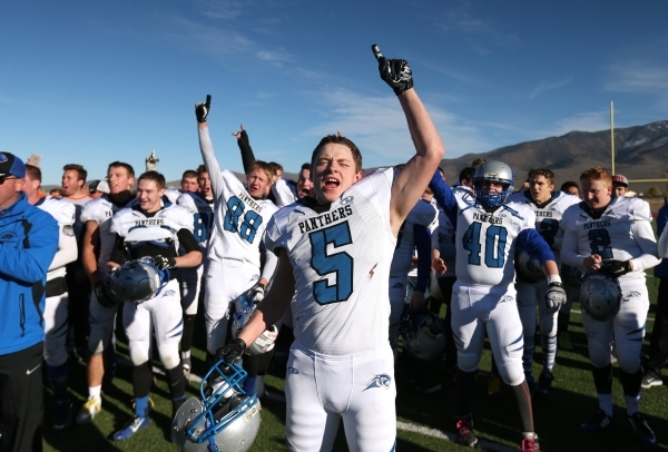 Pahranagat Valley‘s David Ingram celebrates with teammates after defeating Whittell 54 ...