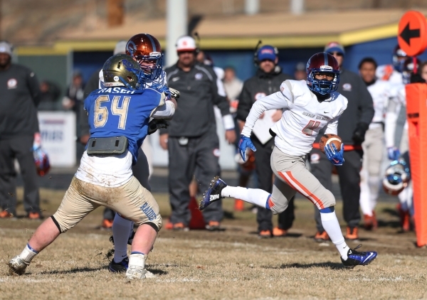 Bishop Gorman‘s Alex Perry runs an interception back for a touchdown against Reed in a ...