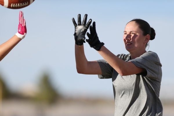 Centennial‘s Izzy Barilla reaches for a catch during a girl‘s flag football prac ...