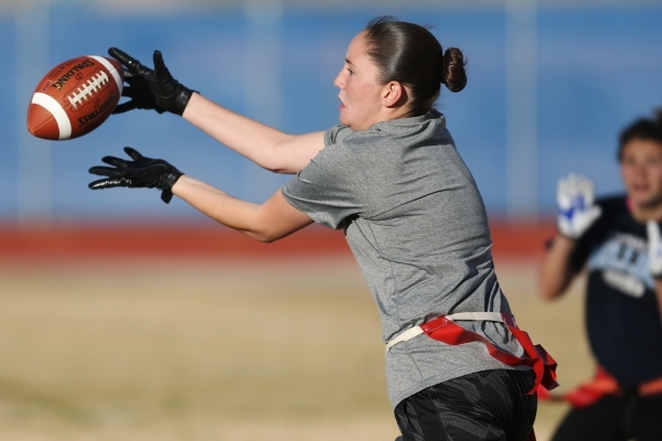 Centennial‘s Izzy Barilla reaches for a catch during a girl‘s flag football prac ...