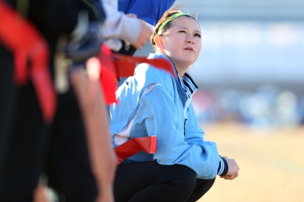 Centennial‘s Courtney Reeves talks with a teammate during a girl‘s flag football ...