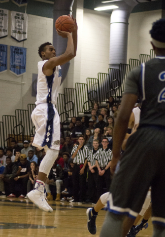 Centennial‘s Troy Brown (0) shoots the ball during their game against Desert Pines at ...