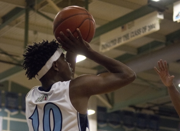 Centennial‘s Isaiah Banks (10) looks to pass the ball in during their game against Des ...