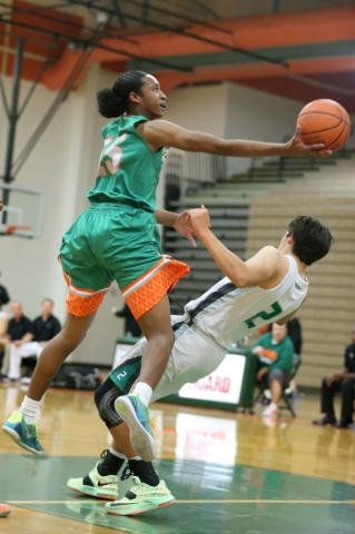 Mojave‘s Richard Edwards (15) takes a shot over Churchill County‘s Conner Richar ...