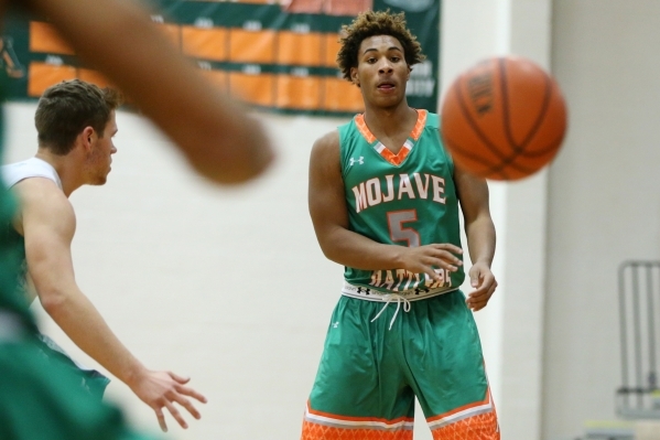 Mojave‘s Tyreon Ward (5) makes a pass against Churchill County in their boy‘s ba ...