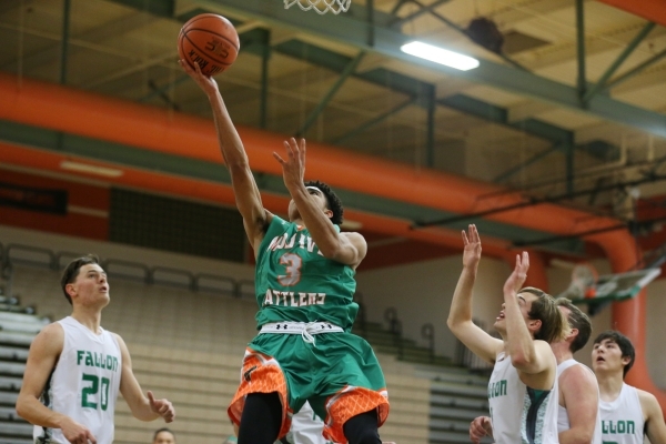 Mojave‘s Daryl Adams (3) goes up for a layup against Churchill County in their boy&lsq ...