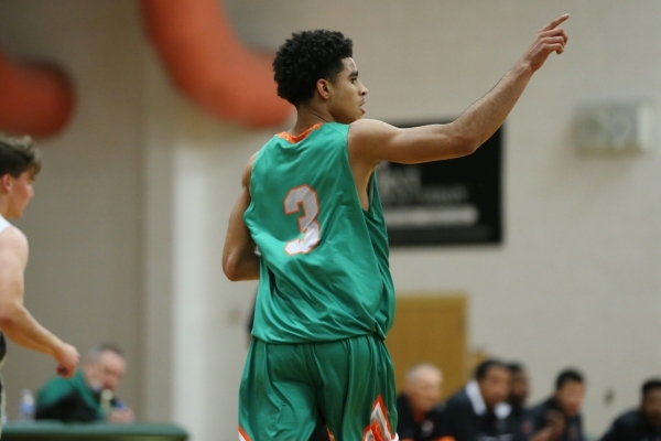 Mojave‘s Daryl Adams (3) reacts after making a shot against Churchill County in their ...