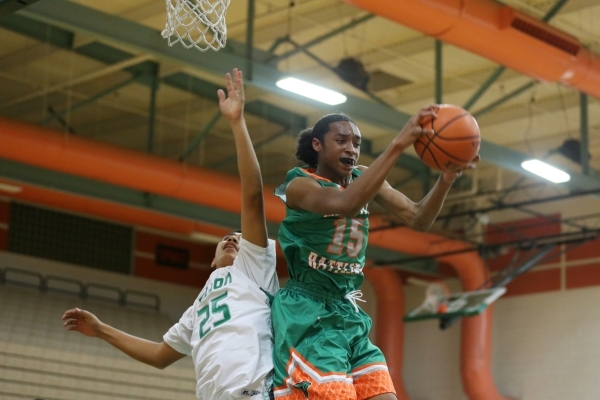 Mojave‘s Richard Edwards (15) gets a rebound against Churchill County‘s Nick Smi ...