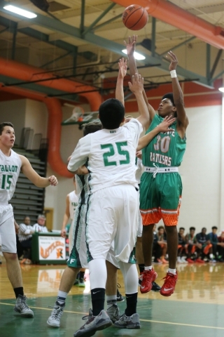 Mojave‘s Lamaja Cunningham (30) takes a shot against Churchill County in their boy&lsq ...