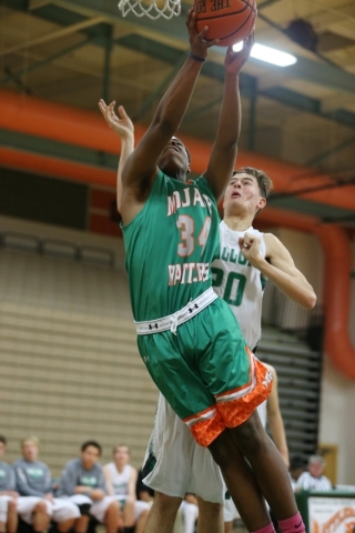 Mojave‘s Markaule Pace (34) goes up for a layup against Churchill County in their boy& ...