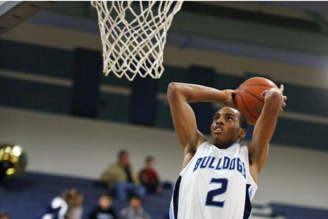 Centennial’s Troy Brown goes up for a dunk during a basketball game against Durango at Cen ...