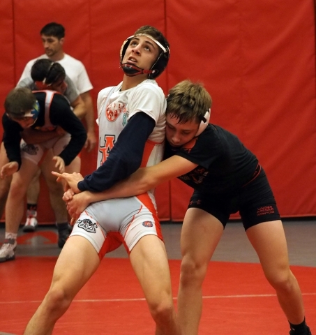 Wrestlers Lawrence Vigil, grey uniform, and Ryder Marchello, black uniform, practice moves a ...