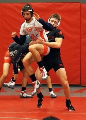 Wrestlers Lawrence Vigil, grey uniform, and Ryder Marchello, black uniform, practice moves a ...