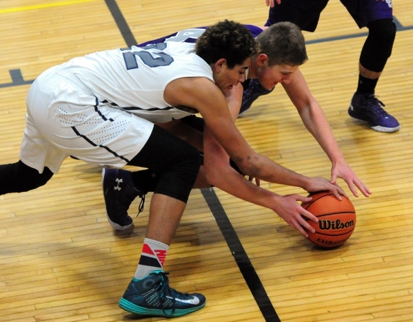 The Meadows School center Max Hisatake (22) fights Spring Creek guard Jake Oliphant for a lo ...