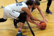 The Meadows School center Max Hisatake (22) fights Spring Creek guard Jake Oliphant for a lo ...