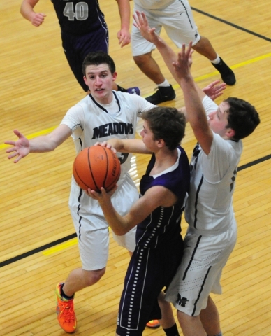 The Meadows School guards Jake Epstein (23) and Ethan Fridman (12) cover Spring Creek forwar ...