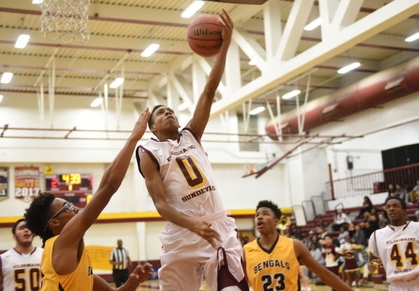 Eldorado‘s Dereonte Allen (0) goes up for a layup against Bonanza‘s defense duri ...