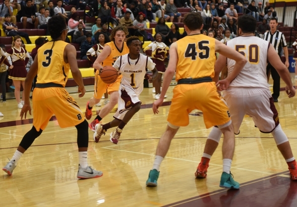 Eldorado‘s Carl Crayon (1) dribbles around the Bonanza defense during their basketball ...