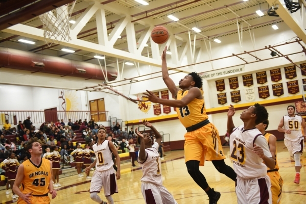 Bonanza‘s Jamal Logan (13) goes up for a layup against Eldorado‘s defense during ...