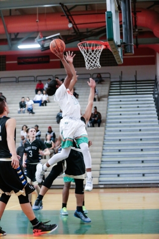 Mojave senior Richard Edwards (15) goes to the basket in a game against Sierra Vista High Sc ...